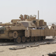 A M1A1 Abrams tank fitted with gun shields for the tank commander and loader, as well as boxes of reactive armor, for urban fighting. Iraq, 2011.